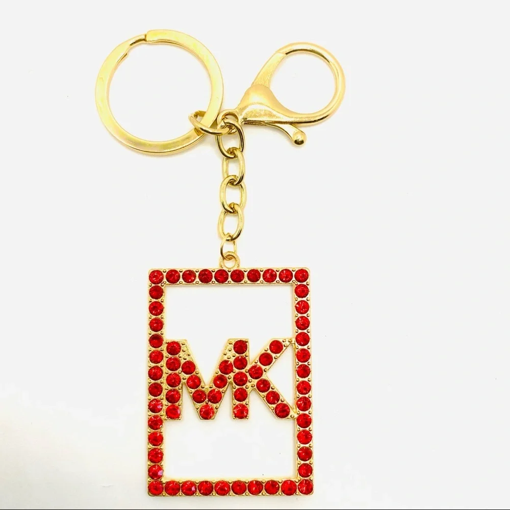 Purse Charm Key Chain MK in Red Crystals set in golden tone.